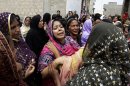 Pakistani women mourn the death of a relatives killed from a fire in a factory in Karachi, Pakistan, Thursday, Sept. 13, 2012. Pakistani police say they have registered a murder case against the owners and managers of a garment factory in the southern city of Karachi where a fire killed hundreds of people. (AP Photo/Fareed Khan)