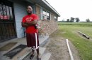 In this July 30, 2013 photograph, Perry Turner, 21, who lives across the road from the planned site for GreenTech Automotive's Tunica, Miss., assembly facility, said there was a lot of talk about the new car company years ago in the county of about 11,000 people south of Memphis, Tenn. But that talk has faded and Perry said there has been little activity at the site until recent months. (AP Photo/Rogelio V. Solis)