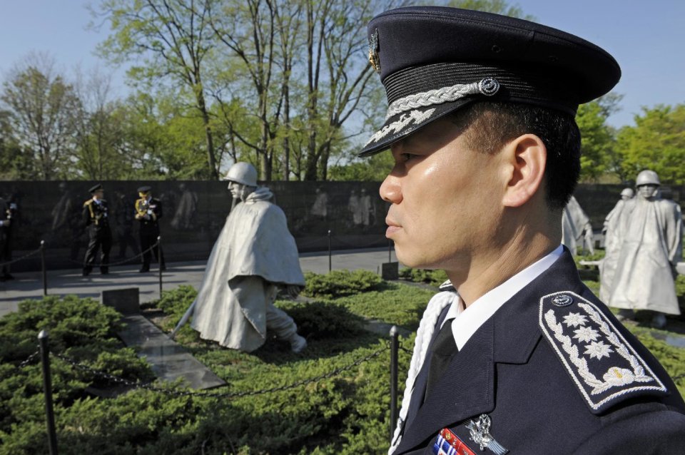 FILE - This April 12, 2010 file photo shows a member of the South Korean military standing at attention at the Korean War Memorial in Washington. President Barack Obama is marking the 60th anniversary of the end of the Korean War. Obama is making remarks Saturday at a commemorative ceremony at the Korean War Veterans Memorial on the National Mall. The 1950-1953 Korean war pitted North Korean and Chinese troops against U.S.-led United Nations and South Korean forces. It ended on July 27, 1953 _ 60 years ago today _ with the signing of an armistice. (AP Photo/Cliff Owen, File)