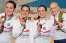 Great Britain's Laura Trott, (2nd L) Elinor Barker (2nd R), Dani King (L) and and Joanna Rowsell (R) pose for pictures with their medals after beating Canada to claim gold in the Women's Team Pursuit in Manchester, on November 1, 2013