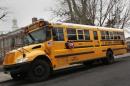 A school bus used for transporting New York City public school students is seen parked in front of a school in the Queens borough of New York