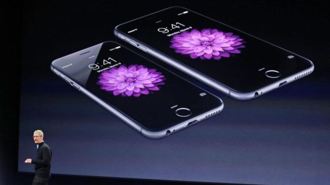 Apple CEO Tim Cook talks about the iPhone 6 and iPhone 6 Plus during an Apple event on Monday, March 9, 2015, in San Francisco.  (AP Photo/Eric Risberg)