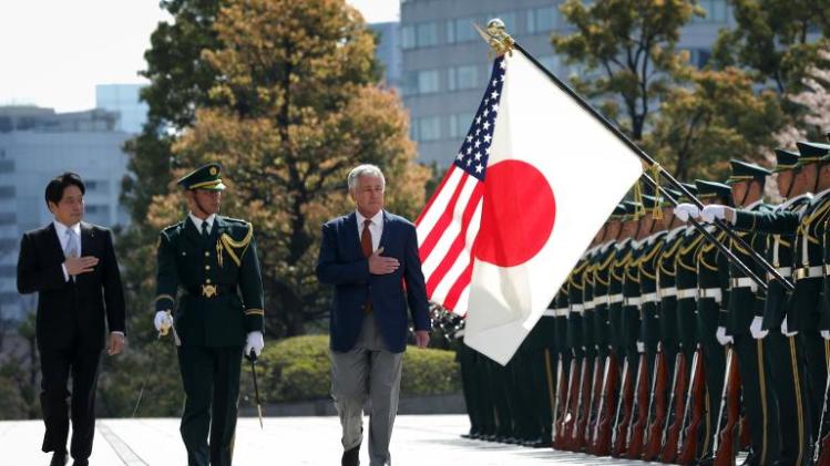 US Secretary of Defense Chuck Hagel (R) reviews an honor guard accompanied by Japanese Defense Minister Itsunori Onodera (L) at the Japanese Ministry of Defense headquarters in Tokyo on April 6, 2014