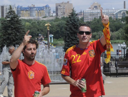 Soccer fans of Spain walk down the street prior to the Euro 2012 soccer championship semifinal match between Spain and Portugal in Donetsk, Ukraine, Wednesday, June 27, 2012. (AP Photo/Sergei Chuzavkov)