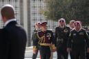 King Abdullah II of Jordan, third from left, arrives to the parliament compound to address the opening session, in Amman, Jordan, Sunday, Nov. 3, 2013. Addressing parliament's opening session Sunday, Abdullah says his 