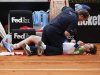 Murray of Britain receives medical care during his match against Granollers of Spain at the Rome Masters tennis tournament