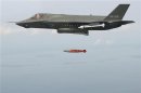 F-35 Lightning II releases an inert 1,000 lb. GBU-32 Joint Direct Attack Munition (JDAM) separation weapon over water in an Atlantic test range in Patuxent River Maryland