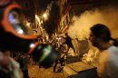 Anti-government protesters clash with riot police near the Prime Minister Erdogan's office in Istanbul