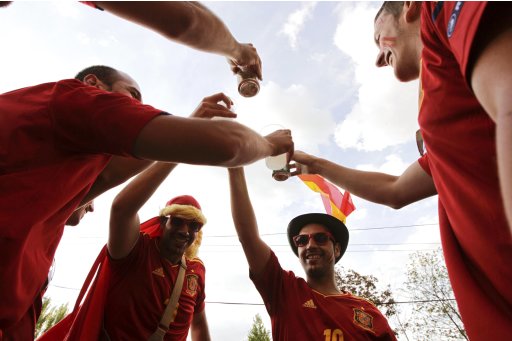 Fans of Spain drink beer in the centre of Donetsk