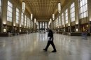 An Amtrak police officer patrols the empty 30th Street Station after all rail travel was cancelled due to damage caused by Hurricane Sandy in Philadelphia
