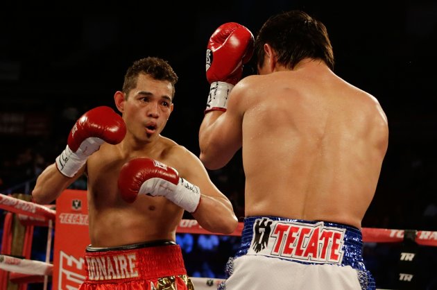 HOUSTON, TX - DECEMBER 15:  Nonito Donaire of the Philippines (L) boxes with Jorge Arce of Mexico during their WBO World Super Bantamweight bout at the Toyota Center on December 15, 2012 in Houston, Texas.  (Photo by Scott Halleran/Getty Images)