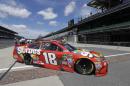 Sprint Cup Series driver Kyle Busch (18) pulls onto pit road during practice for the Brickyard 400 NASCAR auto race at Indianapolis Motor Speedway in Indianapolis, Friday, July 22, 2016. (AP Photo/Darron Cummings)
