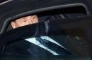 Un'immagine dell'ex premier Silvio Berlusconi, in auto mentre lascia il Senato