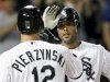 Chicago White Sox's Alex Rios, right, celebrates with A.J. Pierzynski after Rios' home run off New York Yankees starting pitcher Phil Hughes during the sixth inning of a baseball game, Wednesday, Aug. 22, 2012, in Chicago. (AP Photo/Charles Rex Arbogast)