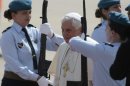 FILE - In this Tuesday, May 11, 2010 file photo, Pope Benedict XVI, center, is saluted by military guards upon his arrival at Portela Airport in Lisbon at the start of a four day visit to Portugal. Attorneys who have tried unsuccessfully for years to sue the Vatican over failures to stop clergy sex abuse are looking into whether former Pope Benedict XVI, who stepped down on Feb. 28, 2013, is more legally vulnerable in retirement, especially when he travels beyond the Vatican walls. (AP Photo/Gregorio Borgia)