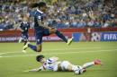 France midfielder Elodie Thomis leaps over South Korea defender Lee Eunmi (2) during first half round of 16 Women's World Cup soccer Sunday, June 21, 2015, in Montreal, Canada. (Paul Chiasson/The Canadian Press via AP) MANDATORY CREDIT