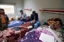 Displaced people who were injured in clashes and fled from Islamic State militants in Mosul, receive treatment at a hospital west of Erbil