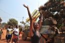 A woman raises her hands following an attack by anti-Balaka Chrisitian militias in the majority Muslim PK 13 district of Bangui, on January 22, 2014