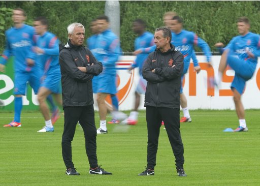 Netherland's coach Bert van Marwijk and Dick Voorn, a member of the technical staff, talk during a training session in preparation for Euro 2012 in Hoenderloo