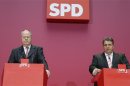 Social Democratic Party (SPD) top candidate Steinbrueck and party leader Gabriel speak at a news conference at the SPD headquarters in Berlin
