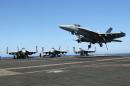 F/A-18 fighter jet takes off at the USS Harry S. Truman aircraft carrier in the eastern Mediterranean Sea