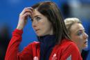 Britain's skip Eve Muirhead looks up at the scoreboard during women's curling competition against South Korea at the 2014 Winter Olympics, Saturday, Feb. 15, 2014, in Sochi, Russia. Anna Sloan is seen at right. (AP Photo/Robert F. Bukaty)