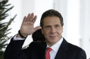 New York Gov. Andrew Cuomo waves to members of the media upon his arrival to the West Wing of the White House in Washington, Monday, Dec. 3, 2012, for a scheduled meeting with White House officials. (AP Photo/Pablo Martinez Monsivais)