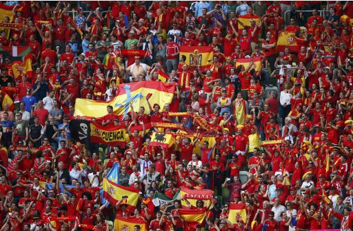 Soccer fans cheer before Euro 2012 soccer match between Spain and Italy at the city stadium in Gdansk