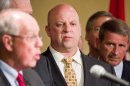 In this April 4, 2012, photo, U.S. Rep. Scott DesJarlais, R-Tenn, center, participates in an law enforcement meeting in Nashville, Tenn. A phone transcript emerged on Wednesday, Oct. 10, 2012, appearing to recount how the freshman congressman seeking re-election on a pro-life platform urged his pregnant mistress to get an abortion more than a decade ago. (AP Photo/Erik Schelzig)