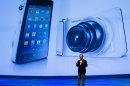 JK Shin, President of IT & Mobile Communications Division at Samsung Electronics unveils the new Galaxy Camera at a Samsung event in Berlin, Wednesday, Aug. 29, 2012. (AP Photo/Markus Schreiber)