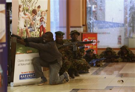 Soldiers and armed police hunt gunmen who went on a shooting spree in Westgate shopping centre in Nairobi September 21, 2013. REUTERS/Goran Tomasevic