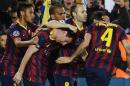 Barcelona's Argentinian forward Lionel Messi (2nd L) celebrates with his teammates after scoring at the Camp Nou stadium in Barcelona on March 12, 2014