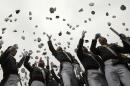 Graduates toss their hats in the air at the end of the commencement ceremony at the United States Military Academy at West Point