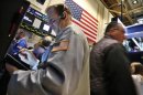 Traders work on the floor at the New York Stock Exchange