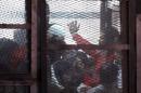 The accused are seen in a cage during a trial of 200 charged with belonging to the Ansar Bait al-Maqdis group, in Cairo court