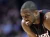 Miami Heat guard Dwyane Wade reacts as he watches a free throw by Chicago Bulls forward Luol Deng during the second half of an NBA basketball game in Chicago on Wednesday, March 27, 2013. The Bulls won 101-97, ending the Heat's 27-game winning streak. (AP Photo/Nam Y. Huh)