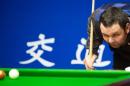 Britain's Stephen Maguire considers a shot at the Shanghai Masters on September 11, 2014