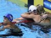 Dara Torres, left, looks at the results after swimming in the women's 50-meter freestyle final at the U.S. Olympic swimming trials as Kara Lynn Joyce and Jessica Hardy, right, celebrate, Monday, July 2, 2012, in Omaha, Neb. (AP Photo/Nati Harnik)