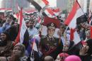Egyptians chant slogans in Tahrir square as they arrive to celebrate former Egyptian army chief Abdel Fattah al-Sisi's victory in presidential vote in Cairo