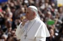 Pope Francis looks on as he arrives at the weekly audience in Saint Peter's Square at the Vatican