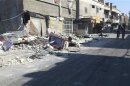 Damaged buildings are seen at Al-Assali neighbourhood in Damascus