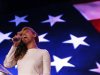Beyonce performs the National Anthem during the halftime show press conference ahead of the NFL's Super Bowl XLVII in New Orleans