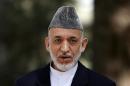 Afghan President Hamid Karzai speaks during a news conference in Kabul