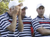 USA's Jim Furyk reacts as European players celebrate after winning the Ryder Cup PGA golf tournament Sunday, Sept. 30, 2012, at the Medinah Country Club in Medinah, Ill. Next to Furyk are Phil Mickelson and Webb Simpson. (AP Photo/David J. Phillip)