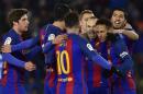 FC Barcelona's Neymar Jr., right, celebrates his goal with Lionel Messi, centre back to camera, after after scoring during the Spanish Copa del Rey, quarter final, first leg soccer match, between FC Barcelona and Real Sociedad, at Anoeta stadium, in San Sebastian, northern Spain, Thursday, Jan.19, 2017. (AP Photo/Alvaro Barrientos)