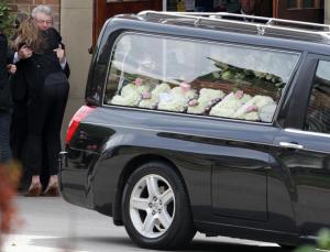 Don Maguire (2nd L) is comforted after the funeral&nbsp;&hellip;