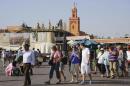 Tourists walk around the Argana restaurant at Marrakesh?s famous Jemma el-Fnaa square