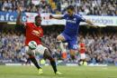 Chelsea's Eden Hazard, right, vies for the ball with Manchester United's Antonio Valencia during the English Premier League soccer match between Chelsea and Manchester United at Stamford Bridge stadium in London, Saturday, April 18, 2015. (AP Photo/Kirsty Wigglesworth)