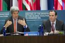 US Secretary of State John Kerry speaks alongside Brett McGurk (R), Special Presidential Envoy for the Global Coalition to Counter ISIL, during a meeting of the Ministers of the Global Coalition to Counter ISIL in Washington, DC, July 21, 2016