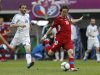 Greece's Fotakis watches as Czech Republic's Rosicky kicks ball during Euro 2012 soccer match in Wroclaw